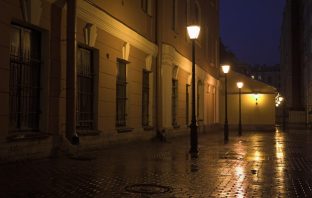 Street lamps and stone pavement at night. Image credit: Thinkstock