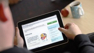 Photograph of a person accessing material on OpenLearn on an iPad