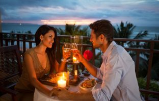 couple enjoying a romantic dinner by candlelight. Image credit: Thinkstock