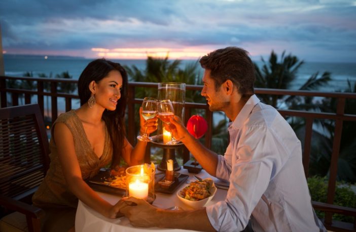 couple enjoying a romantic dinner by candlelight. Image credit: Thinkstock
