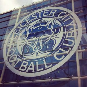 Leicester City FC emblem on front of stadium