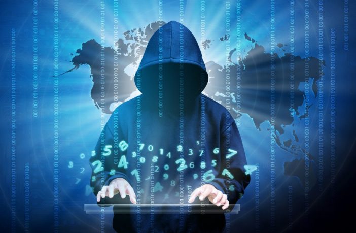 Computer hacker silhouette of hooded man with binary data and network security terms. Thinkstock