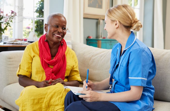 nurse in community setting with patient