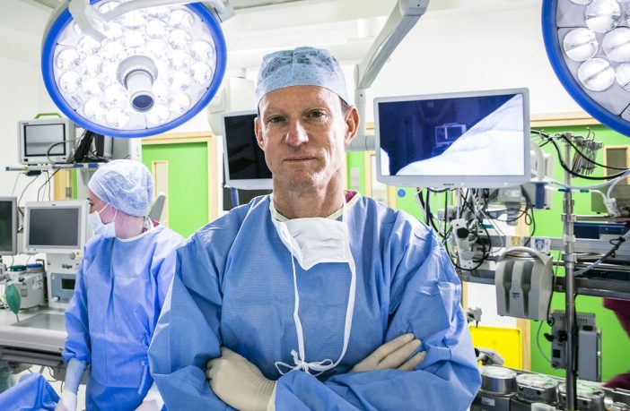 Surgeon standing in operating theatre
