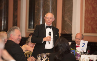 Sir Christopher Coville speaking at a dinner