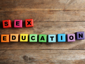 Letter blocks spelling 'sex education'