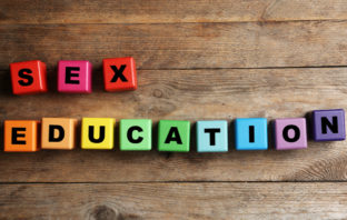 Letter blocks spelling 'sex education'