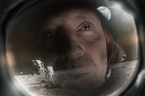 Astronaut looking a moon landscape