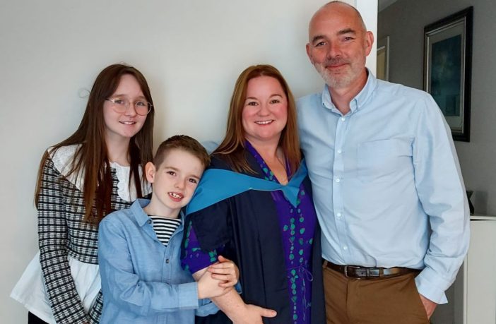 Sharlene celebrates her OU degree with her family