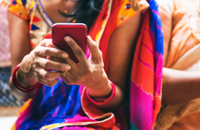 Indian woman using mobile phone