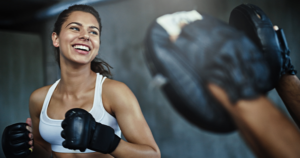 A woman wearing boxing gloves