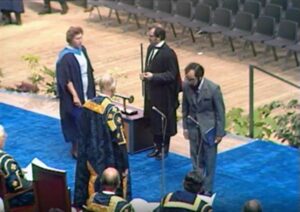 Archive image of Michael crossing the stage.