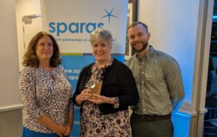 Image shows three members of OU staff with their sparqs award