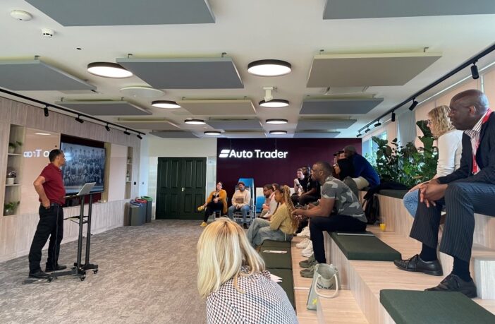 Image of first Learning Hub session at Autotrader in Manchester. Tony Whelan is presenting to an audience.